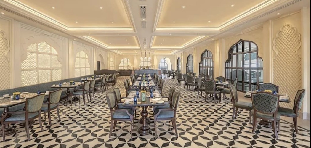 ELEV&Eacute; luxury dining hall with ornate architectural details and upholstered chairs
